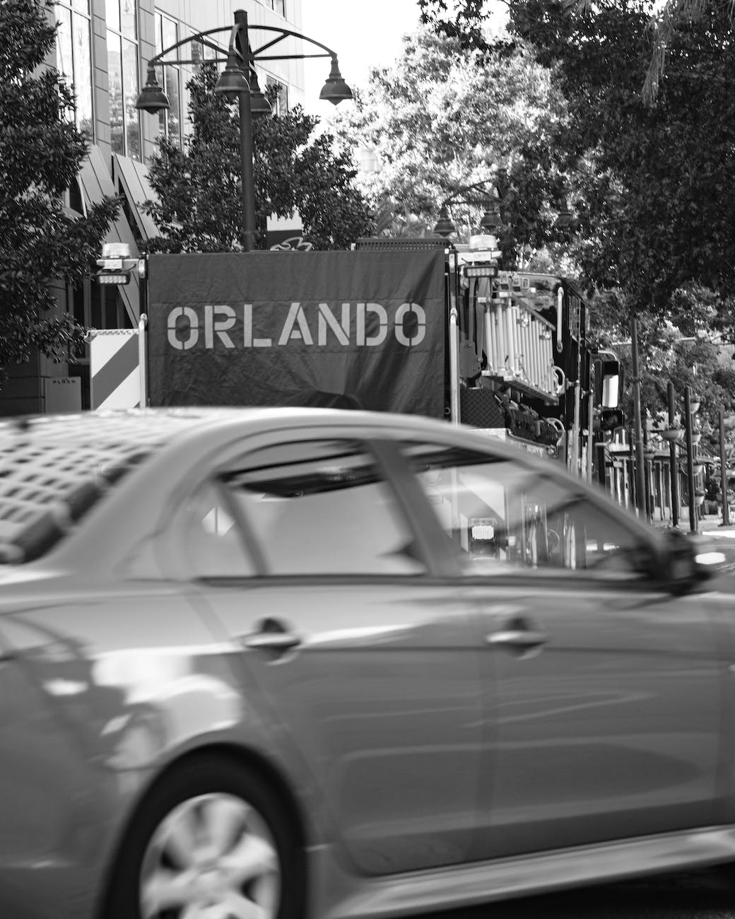 grayscale photo of a car on the road