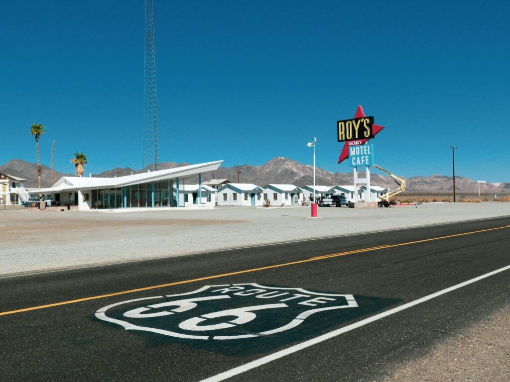 a route 66 sign on the side of a road USA